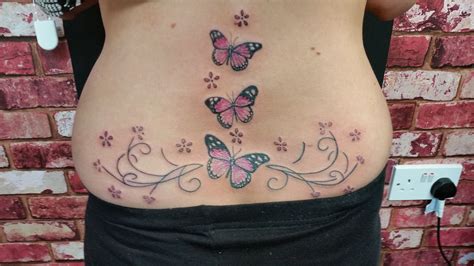 butterfly cute tattoo|butterfly tattoos on bottom of back.